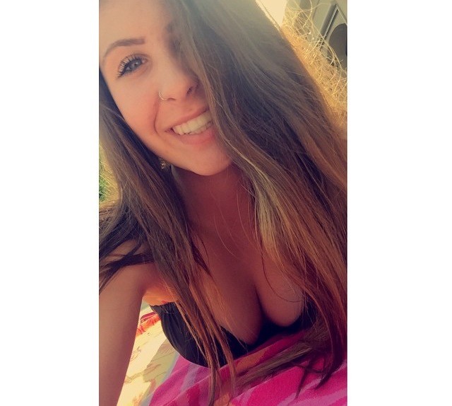 Curvy Brunette Teasing The Camera