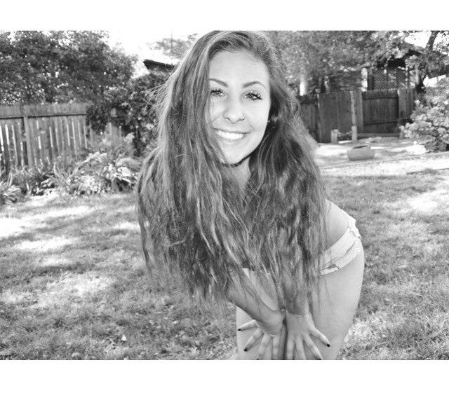 Curvy Brunette Teasing The Camera