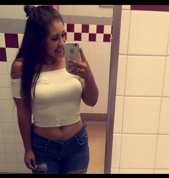 Curvy Brunette Teasing The Camera