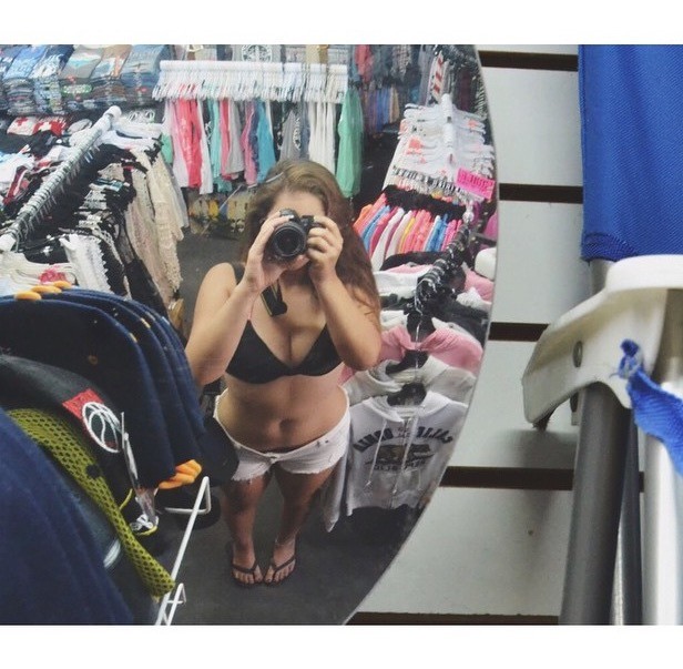 Curvy Brunette Teasing The Camera