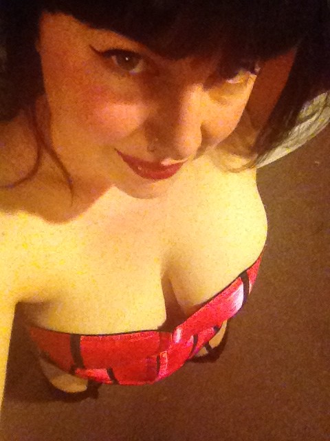 Curvy Brunette In Red Llipstick And Stockings