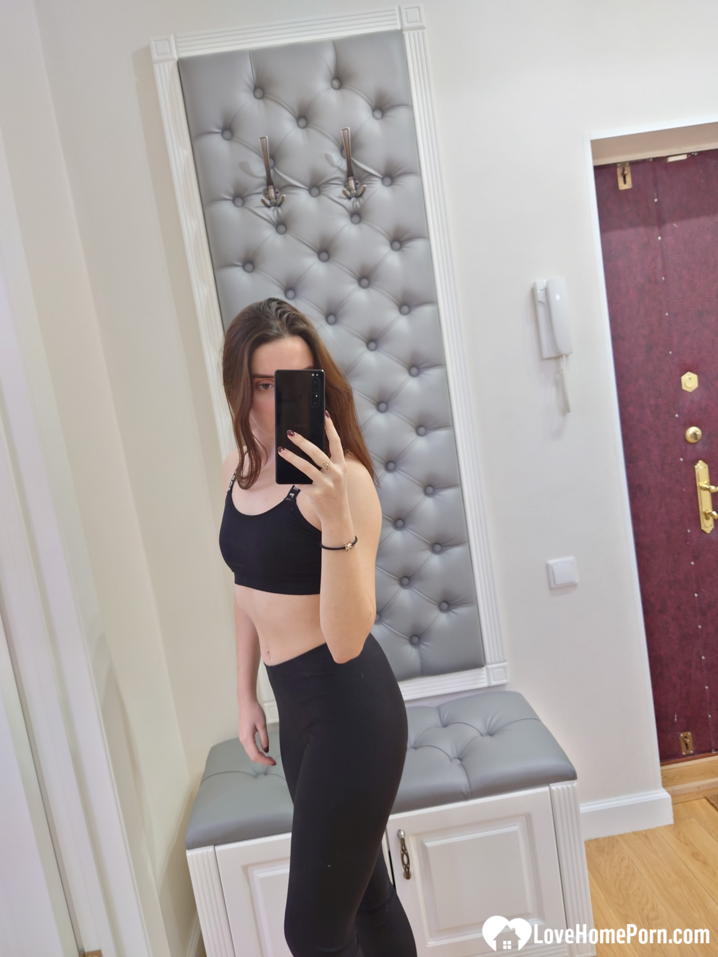 Cutie shows her stockings while posing passionately