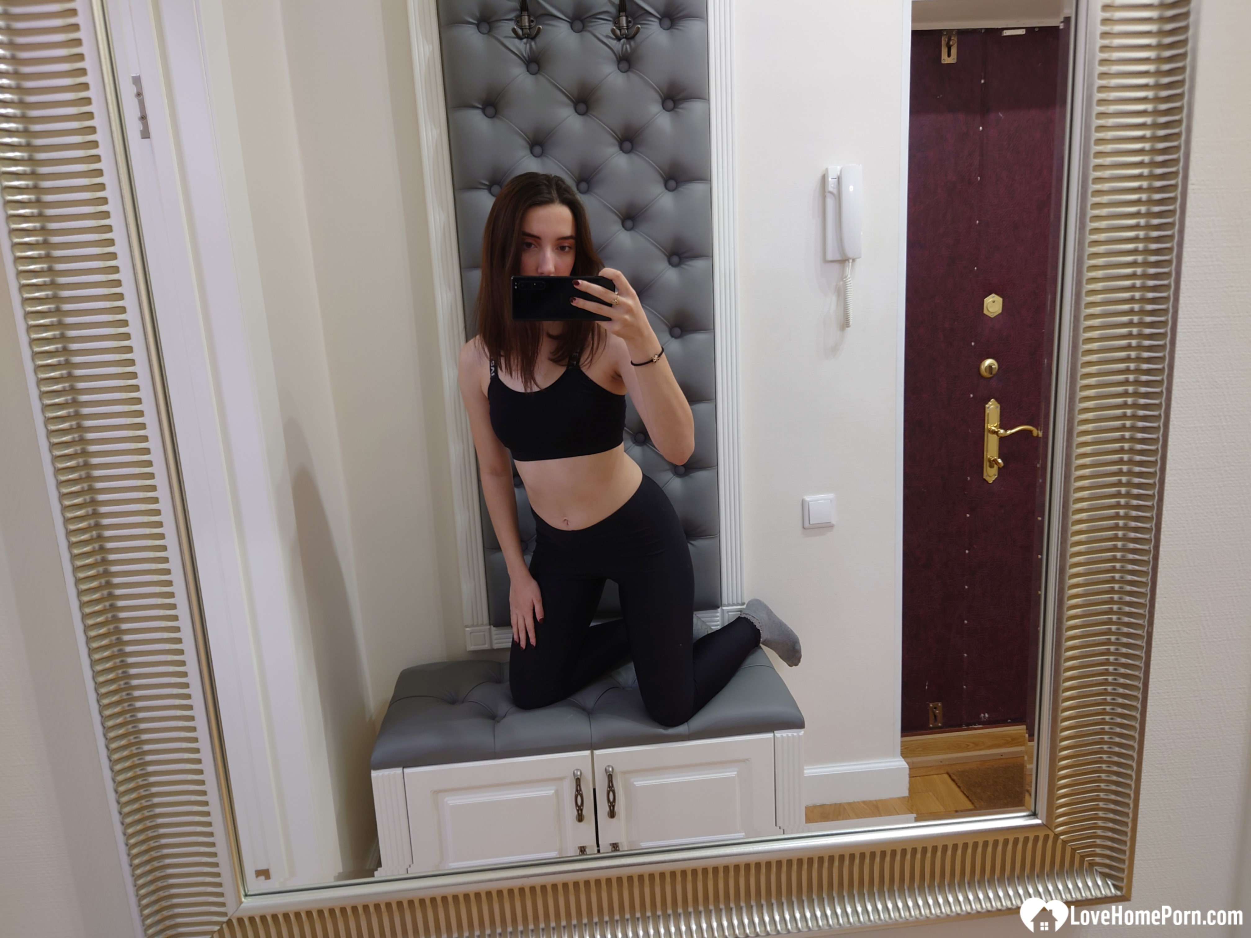 Cutie shows her stockings while posing passionately