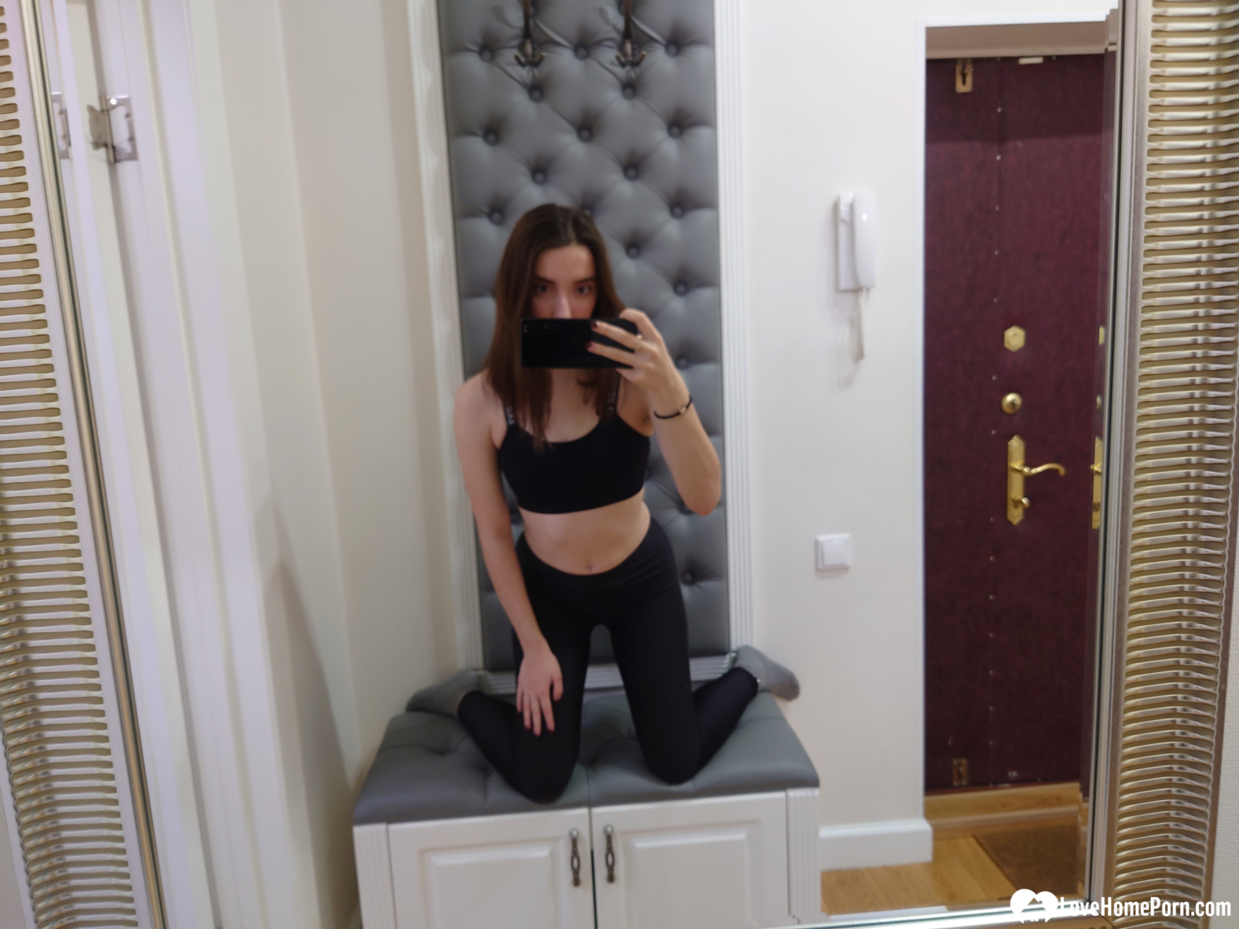 Cutie shows her stockings while posing passionately