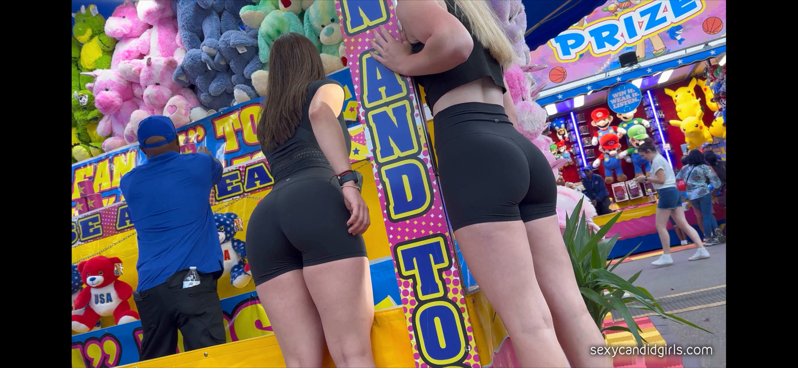 Best friends in matching booty shorts at the Carnival