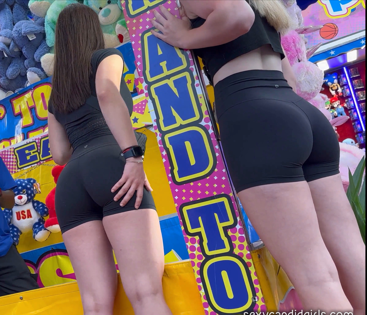 Best friends in matching booty shorts at the Carnival