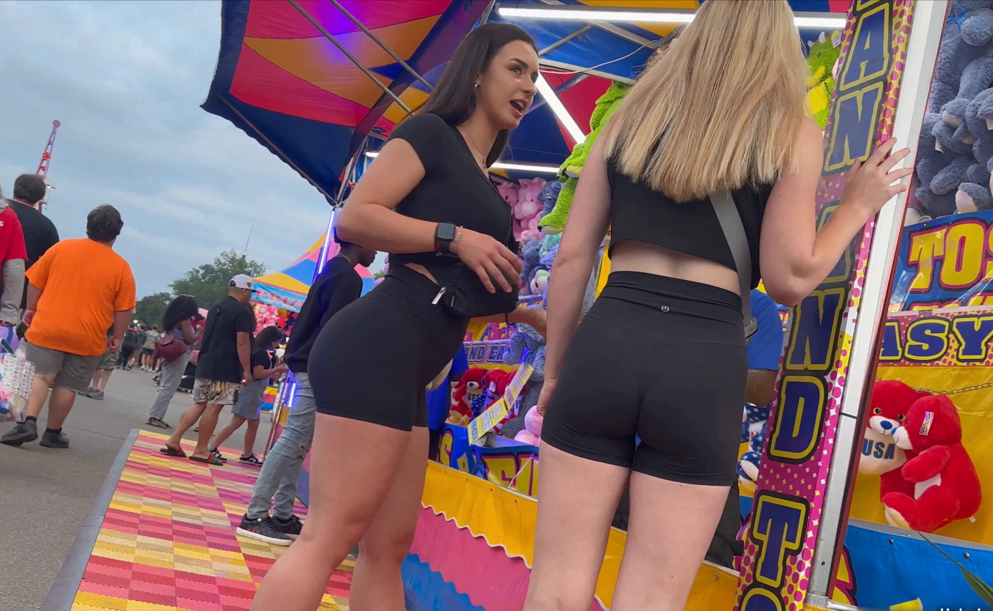 Best friends in matching booty shorts at the Carnival