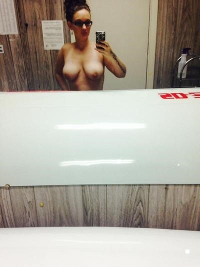 Sexy slut nurse Jackie loves showing off tits, ass, and puss