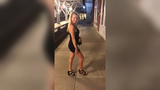 Cute young wife flashes panties in Public