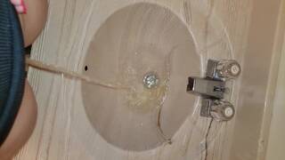 Girl Stands to Pee in Sink like a Boy