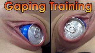 My wife trains  stretching her pussy with soda can and coffee can