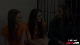 Jailed dyke anally toyed in threeway while stretching butt