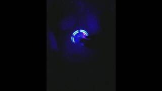 Topless girl spinning fidget spinner