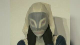 Girl In Blue White Latex Catsuit Mask Plays Breath Play With Rubber Sheet