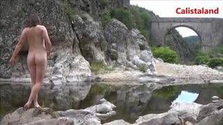 Young naked woman in a river