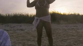 Wow! Sunset Sarong. Nude beach MILF public standing pee. Exposed pussy and sheer covered nipples.