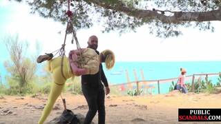 Public whore suspension bondage exposed with buttplug in ass