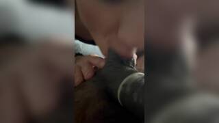 Asian guy moaning while getting his balls sucked by a white girl