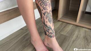 Redhead spreads her legs to finger herself