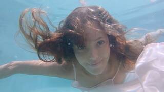 Big boobed naked Russian babe Katya Clover teasing under the water outdoor