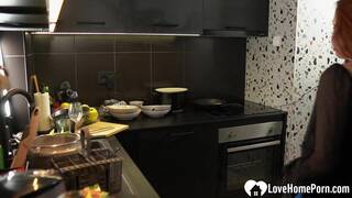 Busty redhead gets shafted in the kitchen