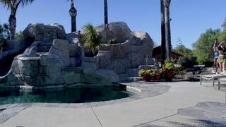 Hailey Reed and Anna Claire Clouds on a grey coloured sofa in several lesbian scenes