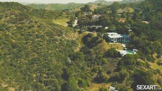 Kylie Rocket and Scarlett Alexis on a grey coloured sofa in several lesbian scenes