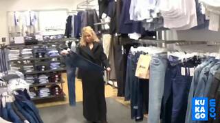 Big-Titted Blonde Fingers Herself in a Public Changing Room