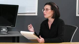 Eliza Ibarra and Whitney Wright inside an office lesbian and Casey Calvert watches