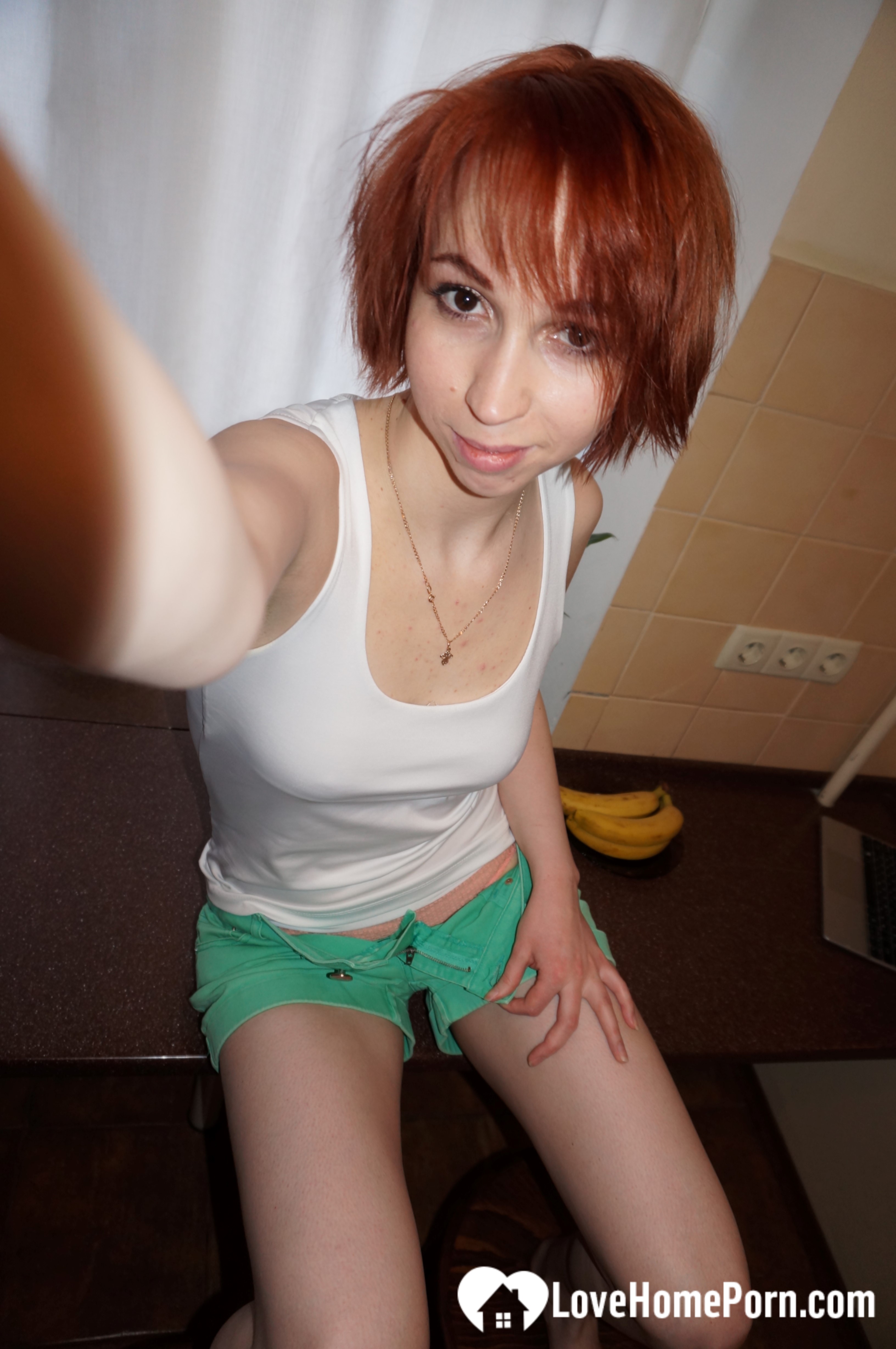 Beautiful redhead knows how to highlight her goods