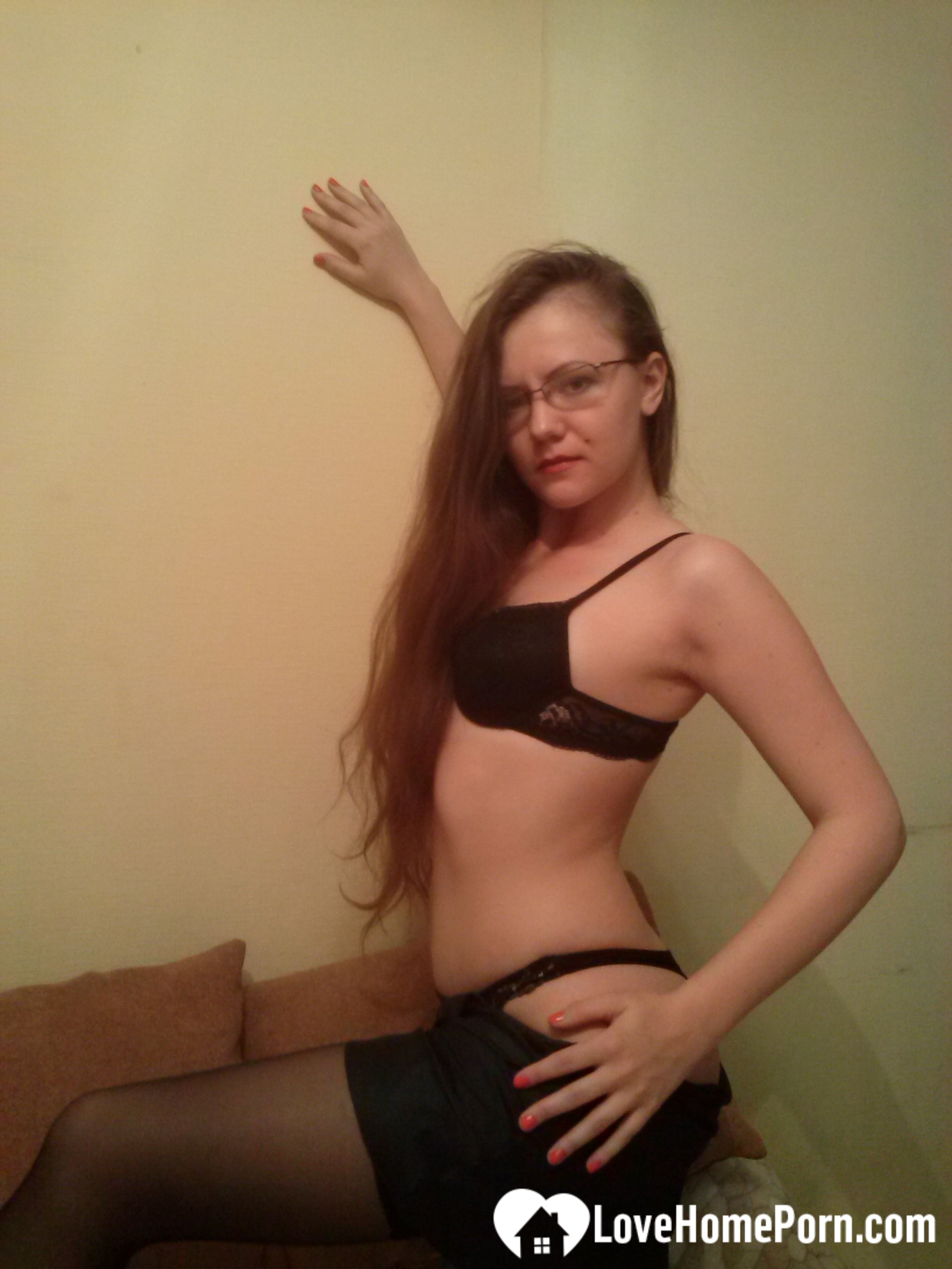 Nerdy babe in stockings displays her cunt