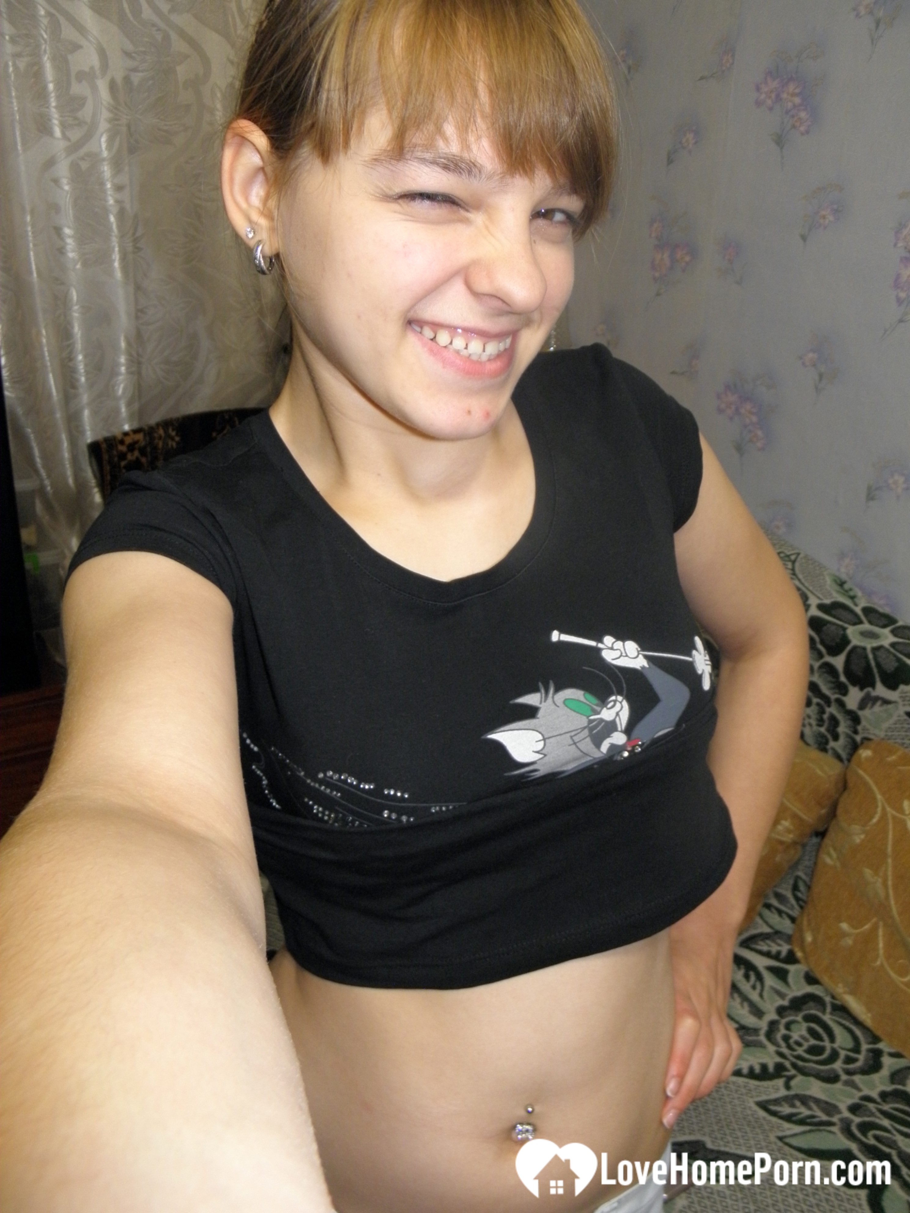 Petite teen slowly strips off her clothes