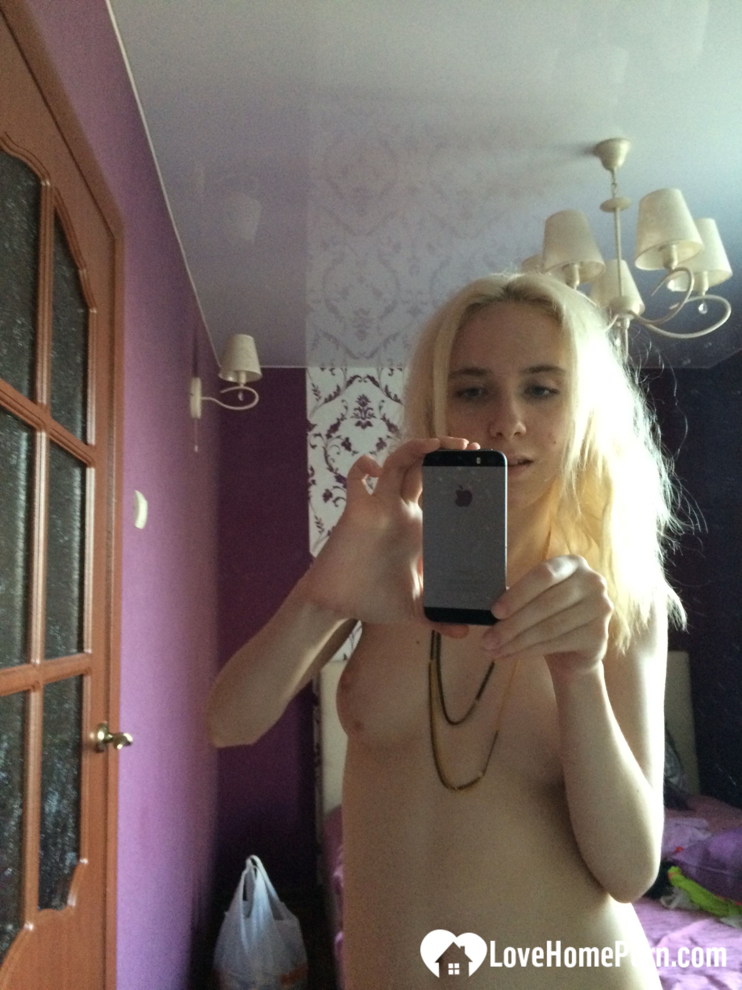 Skinny blonde cutie taking a couple of selfies