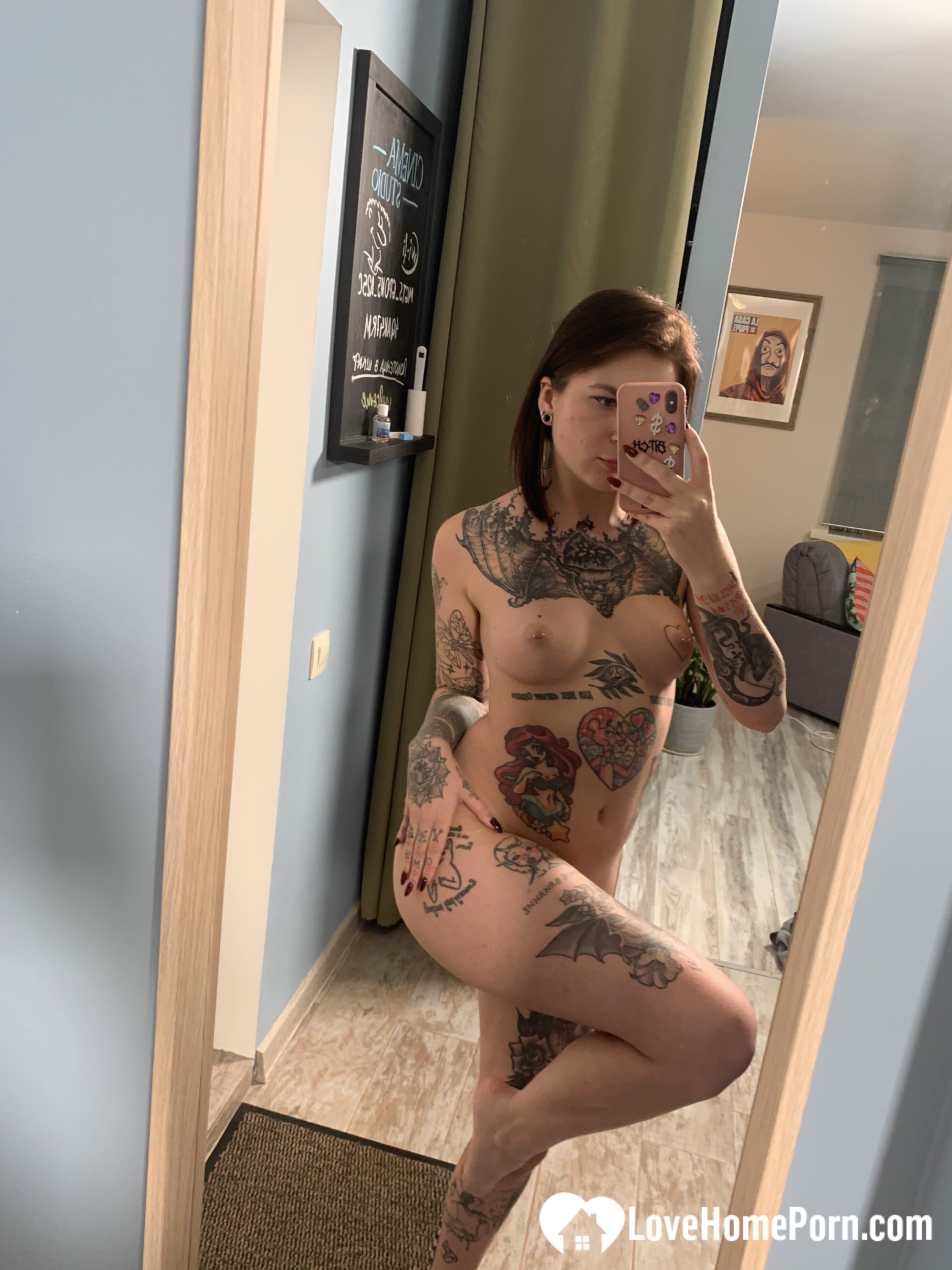 Tattooed babe taking selfies with amazing angles