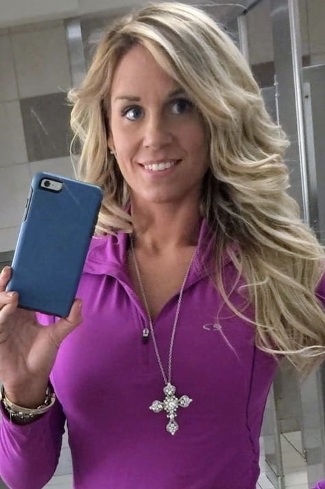 Blonde MILF with huge tits taking Selfies