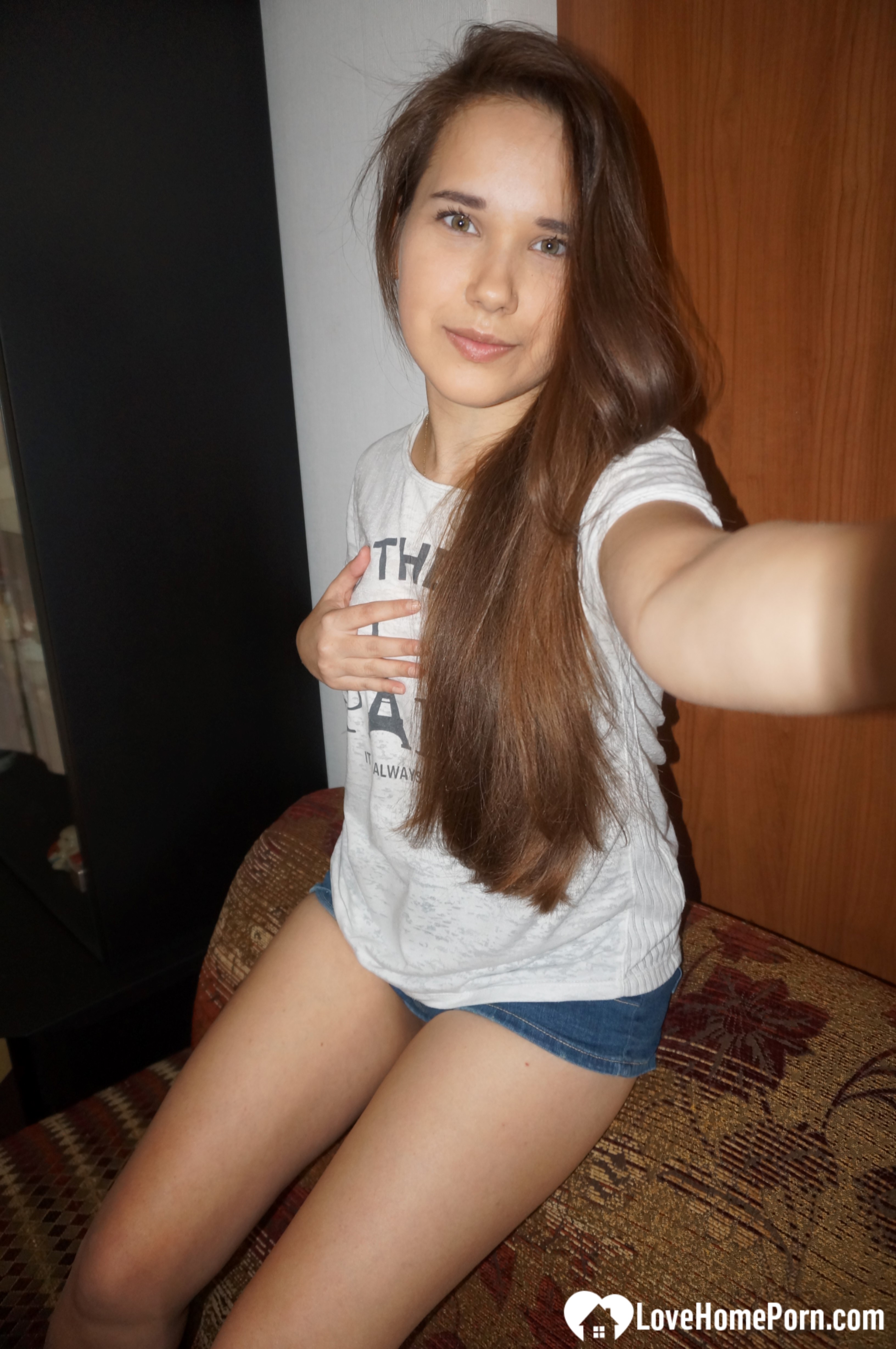 Long-haired teen loves to pose and take nudes