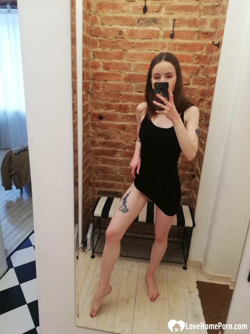 Skinny teen takes selfies in the mirror