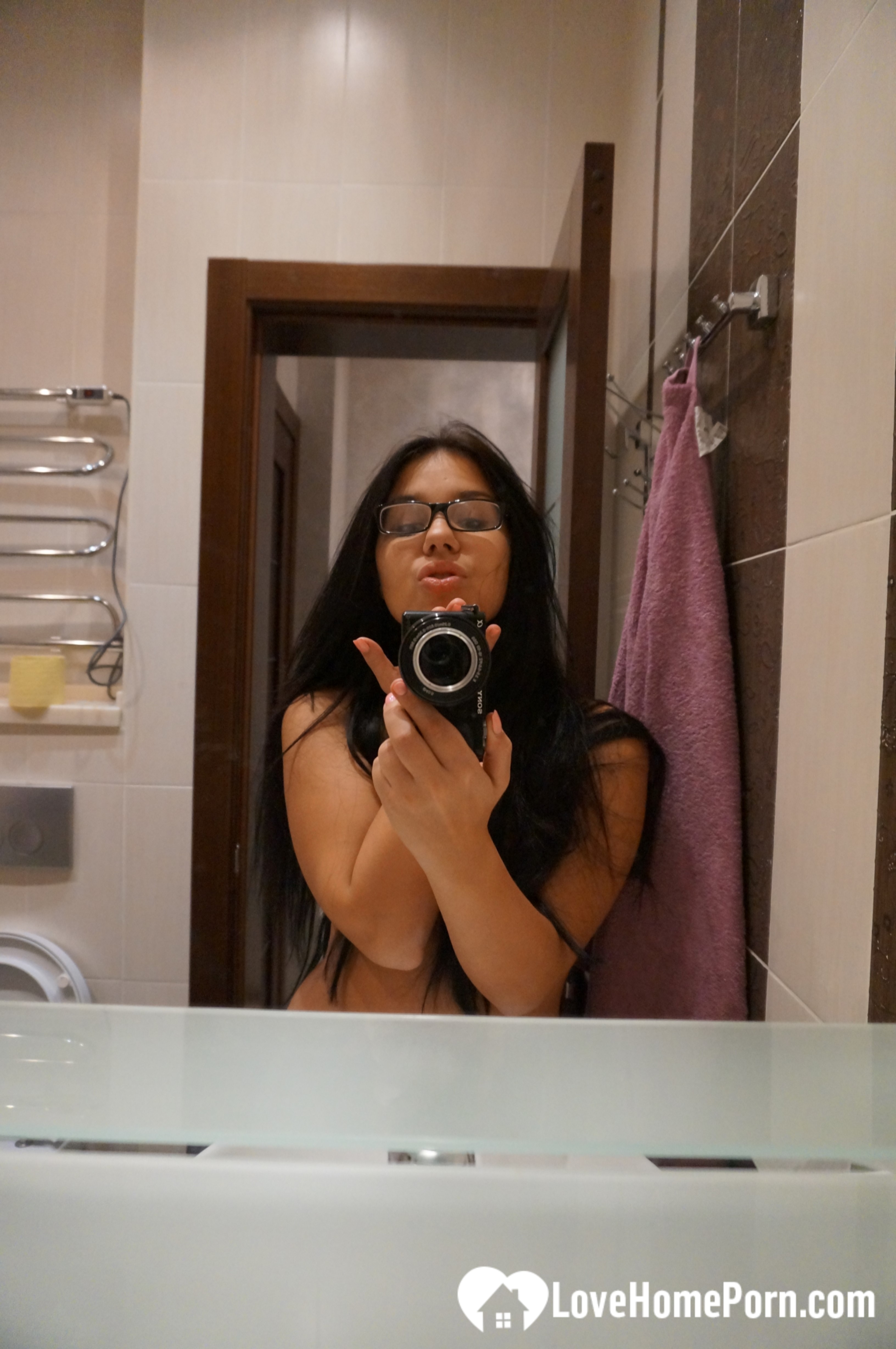 Cute nerdy babe taking some hot selfies