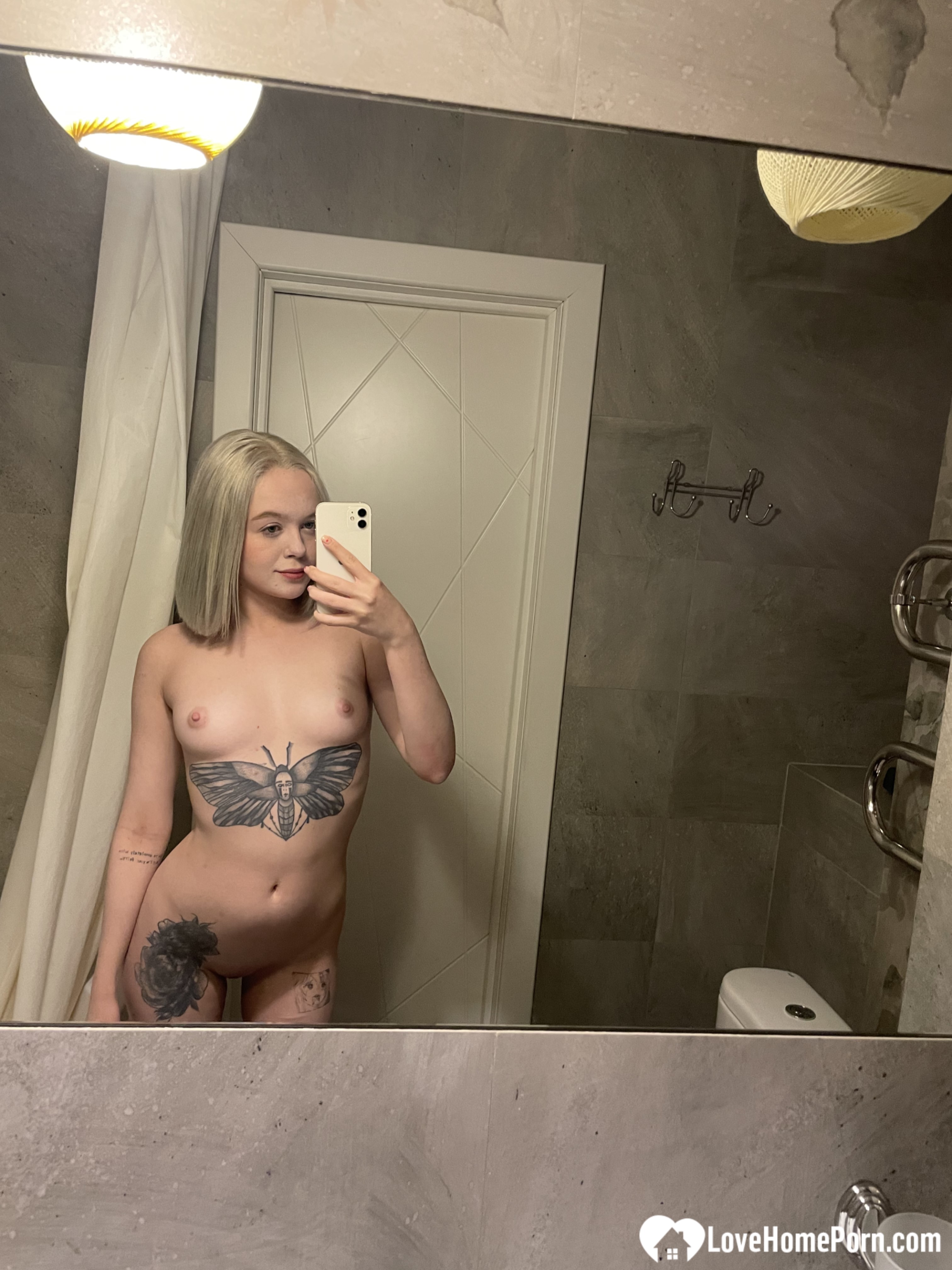 Tattooed blonde showing off her sexy tattoos