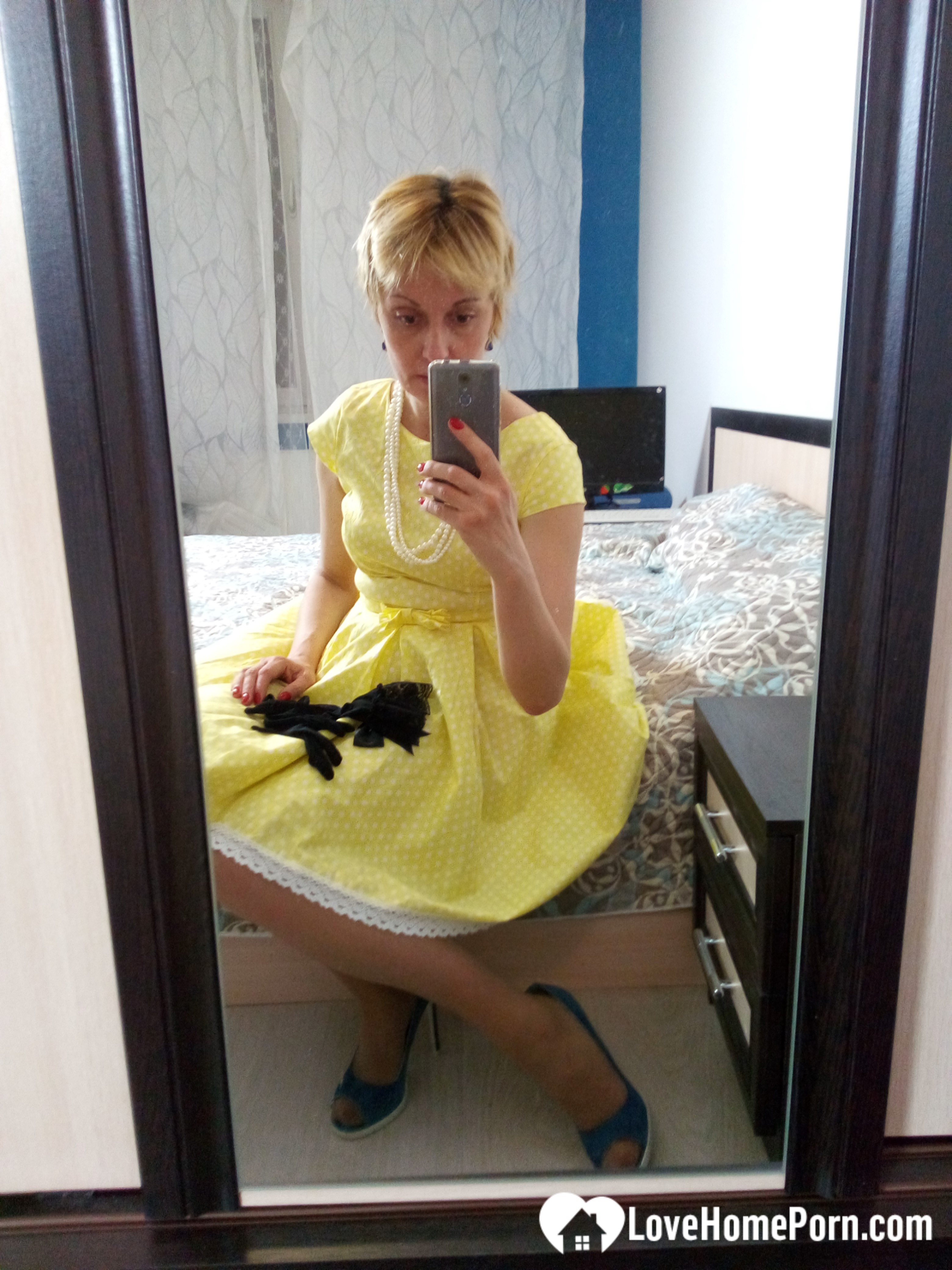 Stunning MILF puts on a yellow dress
