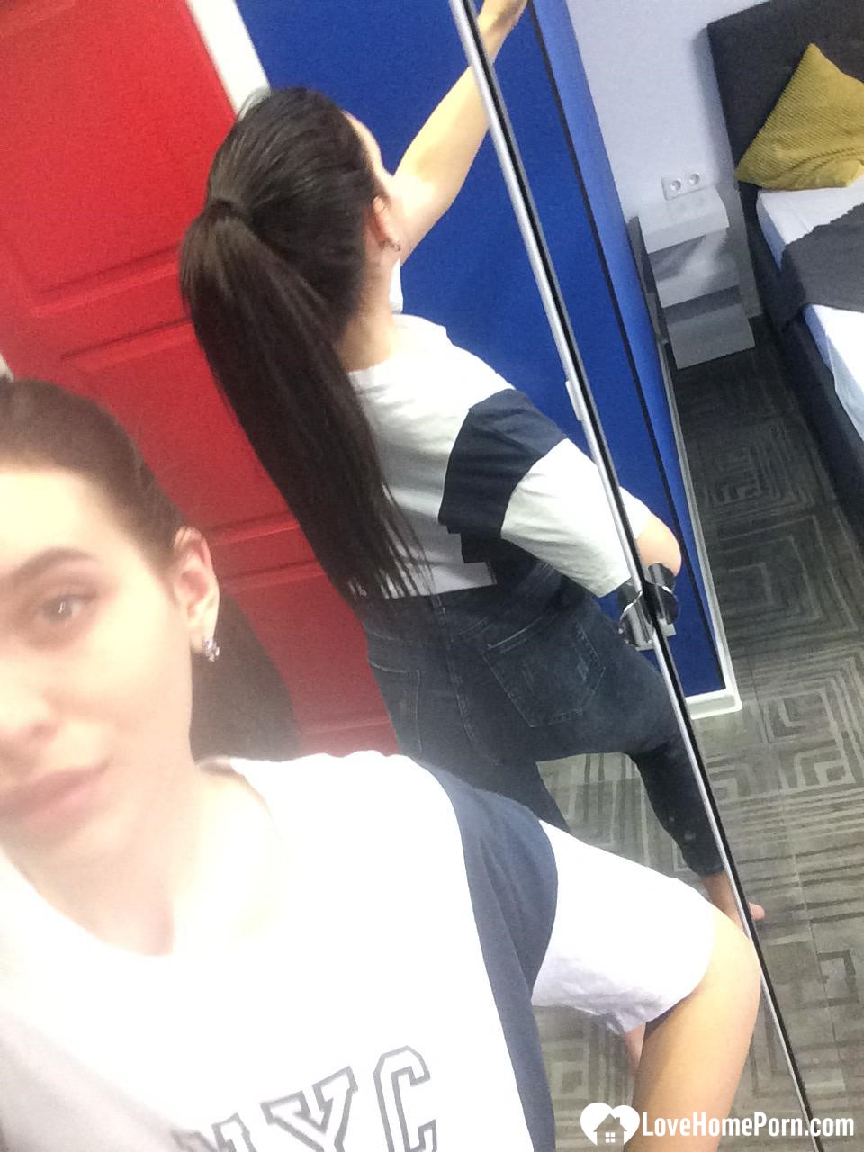 Cute long-haired brunette takes selfies in the bathroom