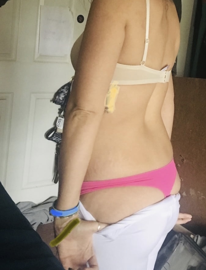 Wife posing in a pink thong