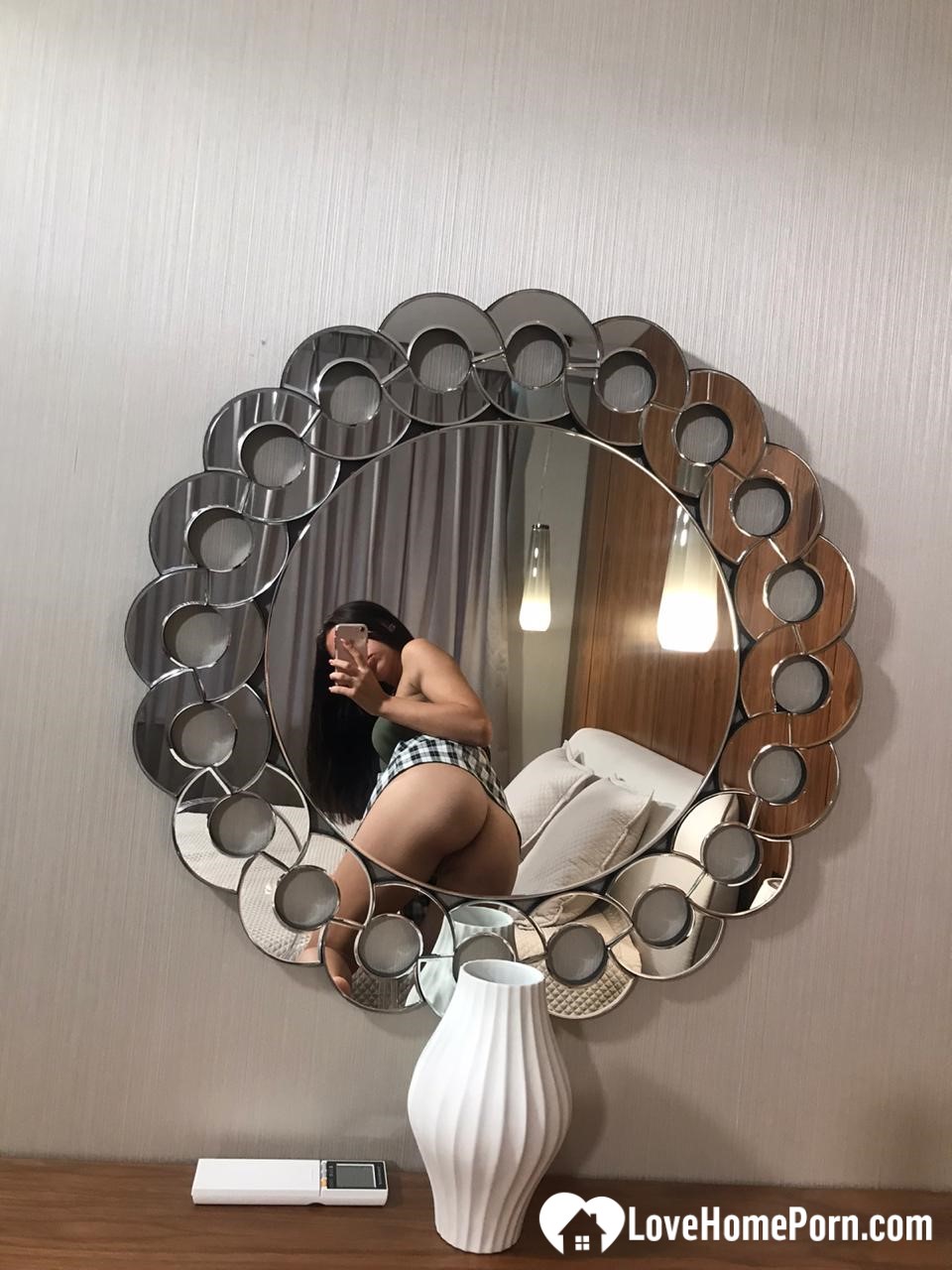 Hot schoolgirl reveals her tits in the mirror