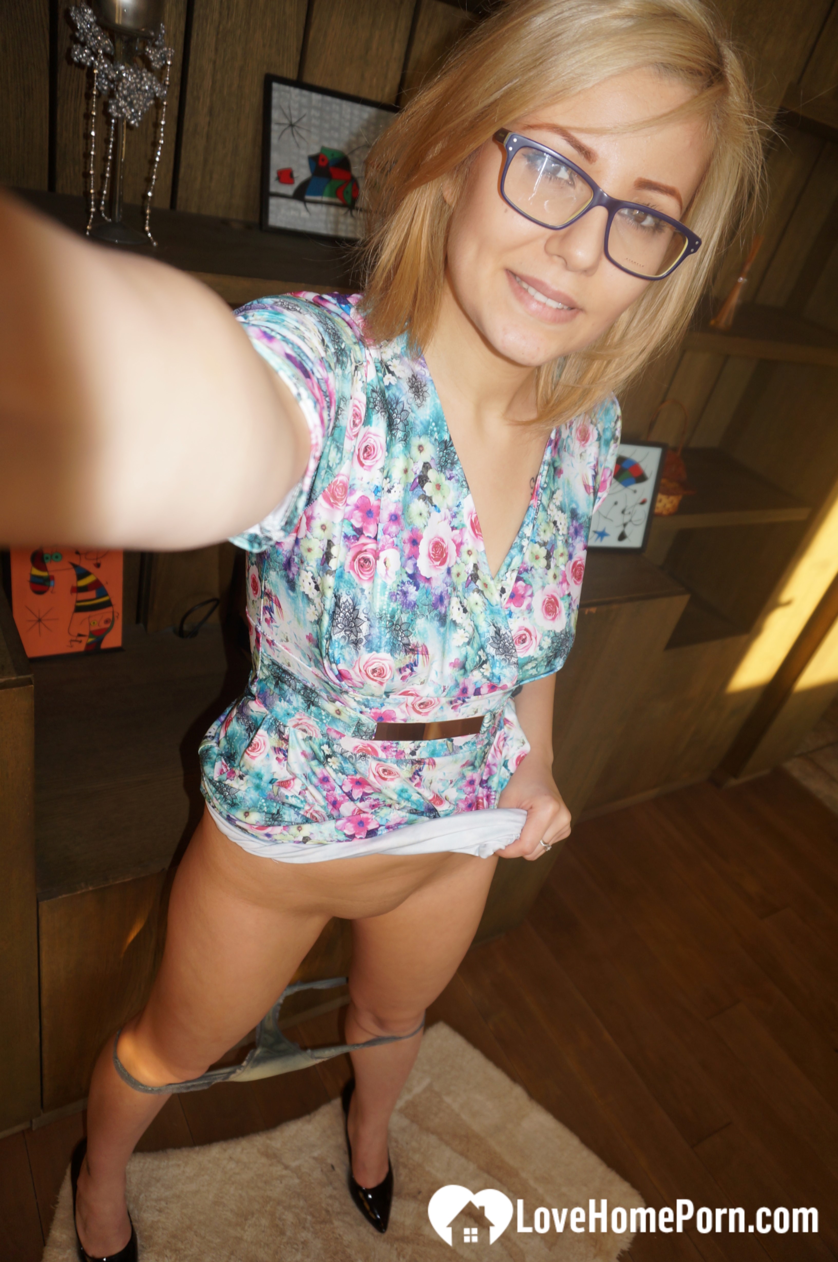 Amateur blonde with glasses exposes her naughty side