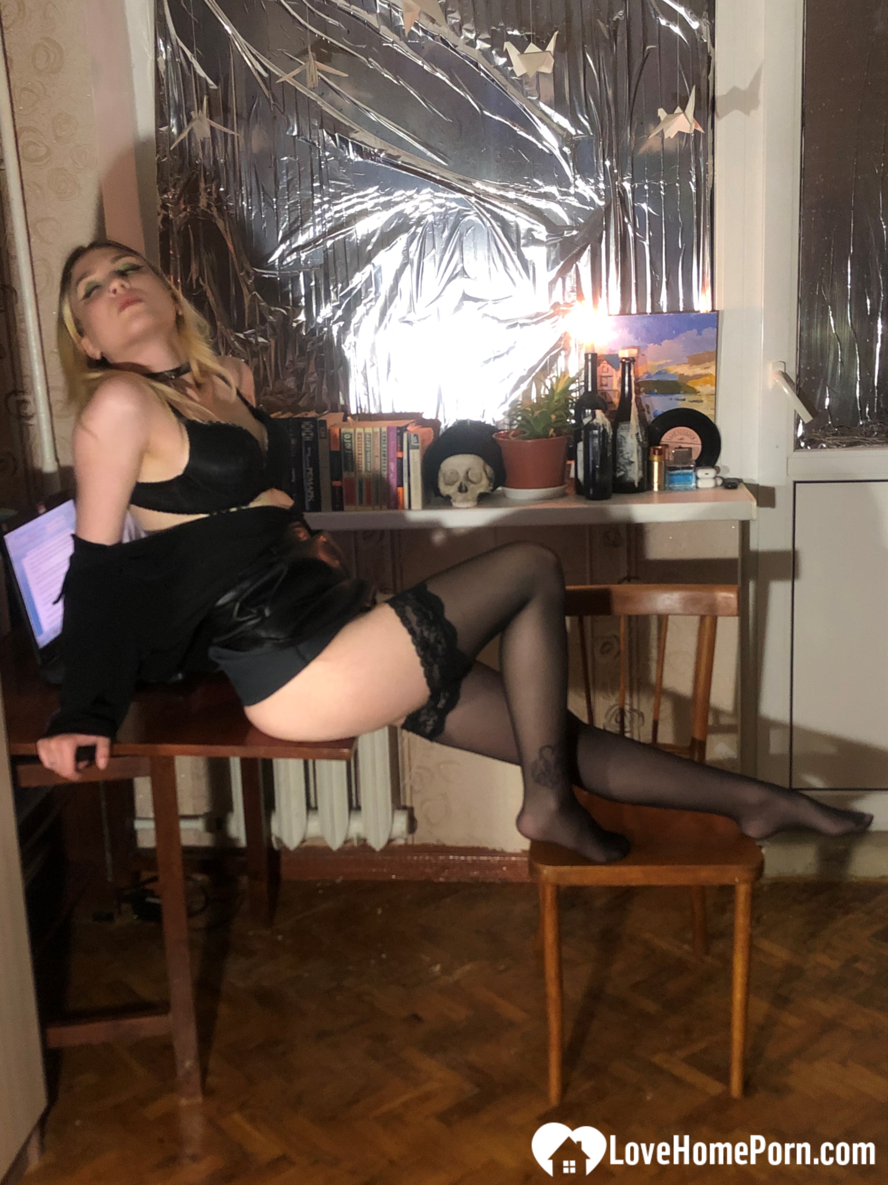 Hot blonde in stockings strips her lingerie