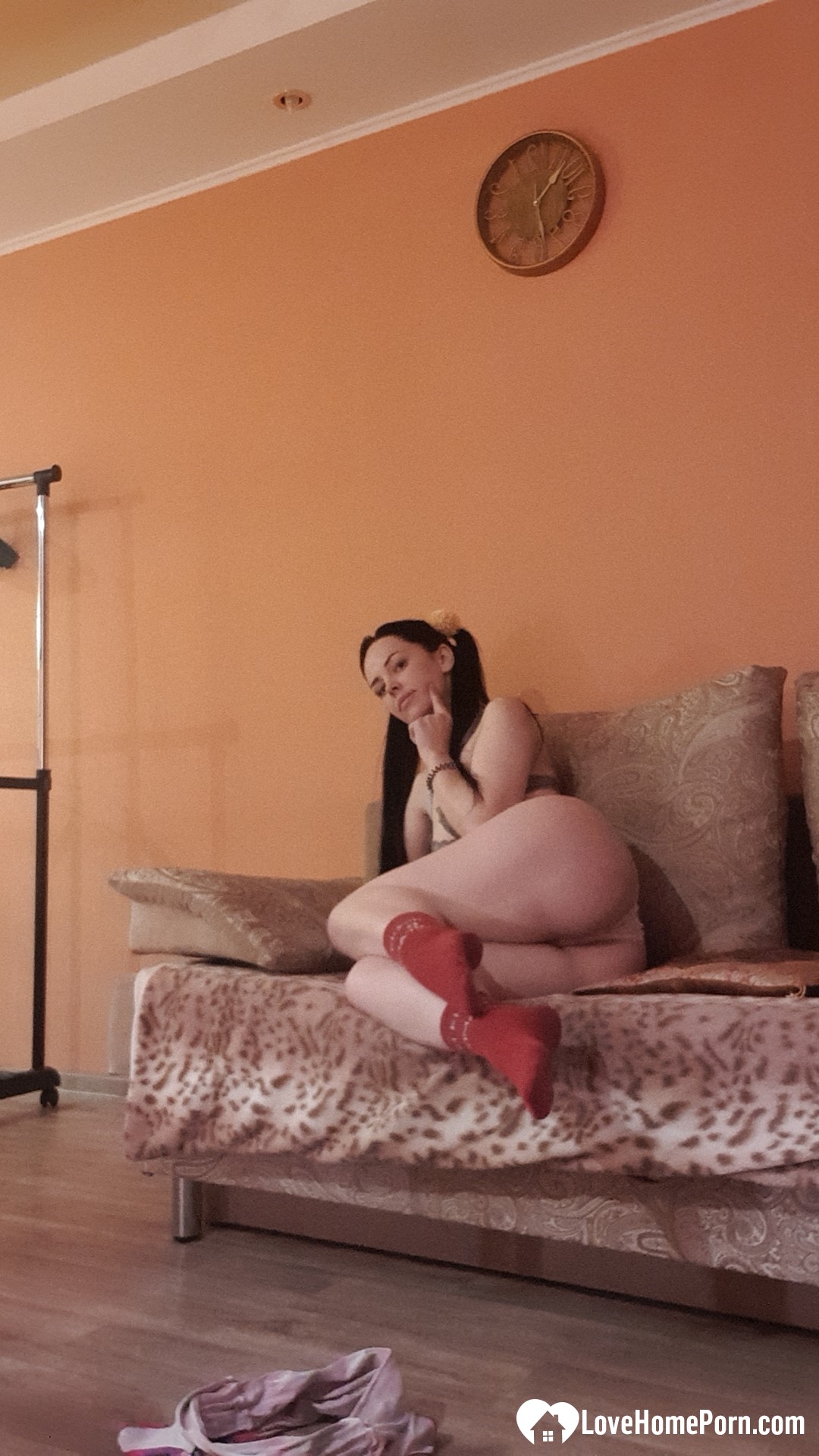 Brunette with pigtails poses in knee socks