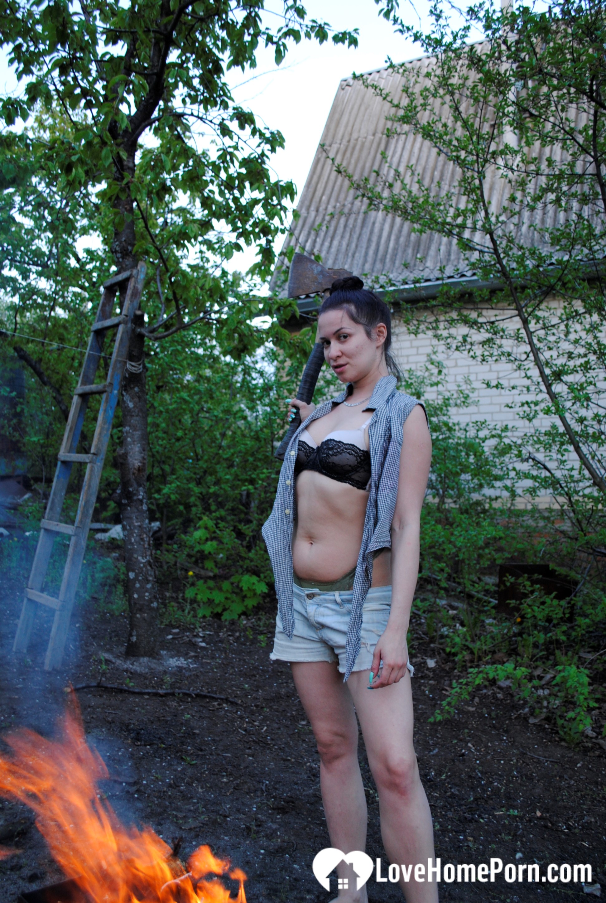 Barbecuing makes her hot so she strips