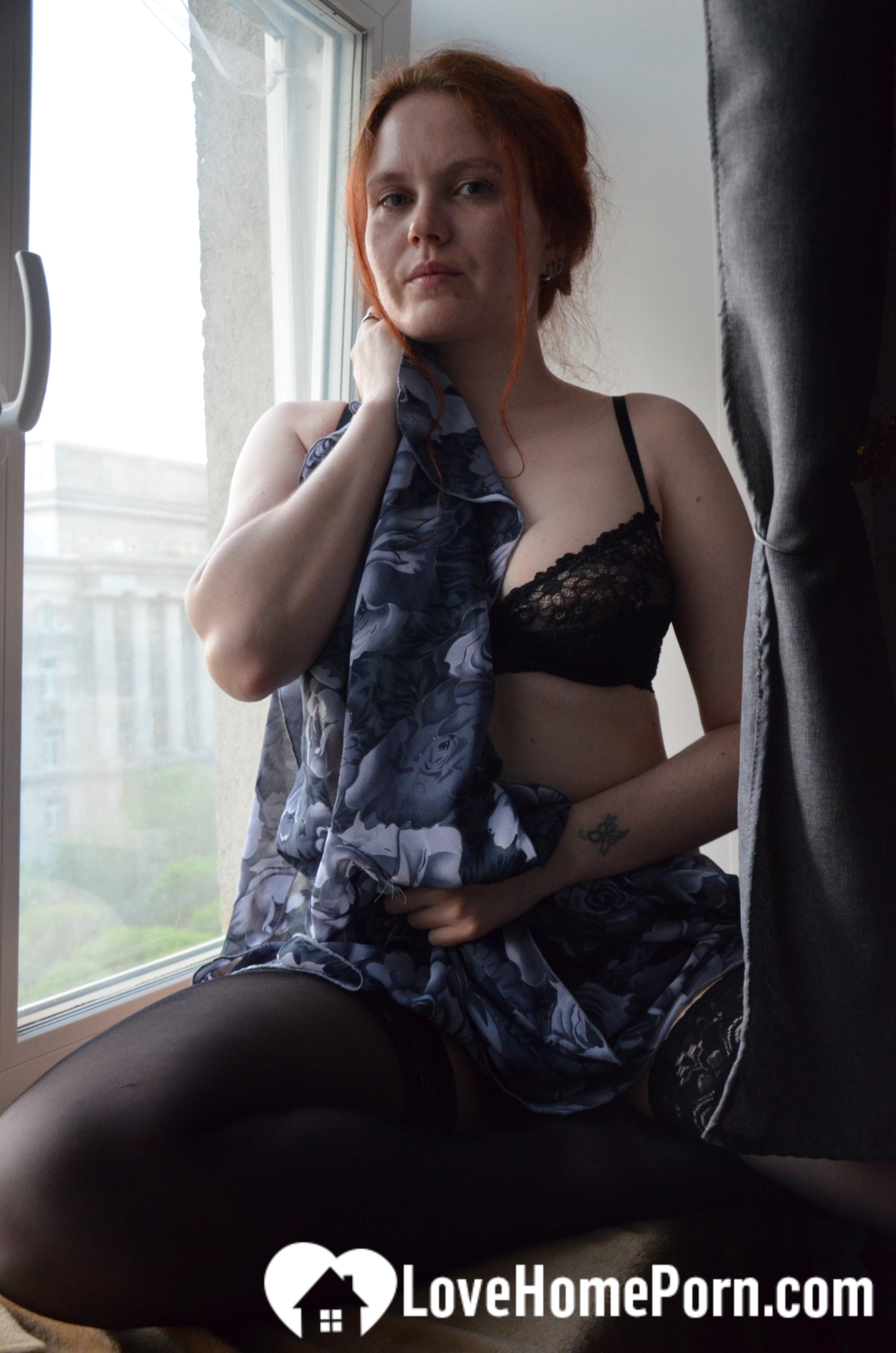 Posing by the window in a hot outfit