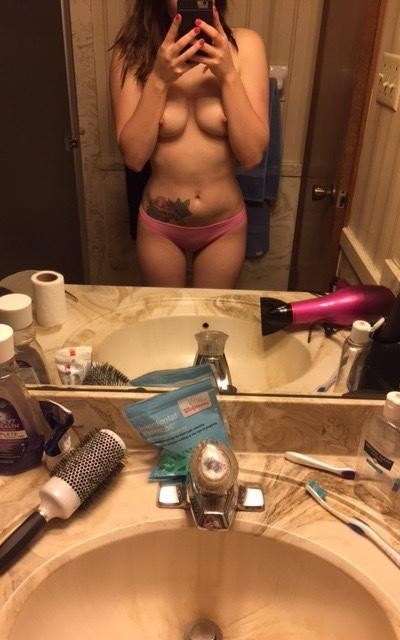 Nice Girl In Front Of Her Mirror